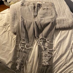 Grey jeans. High waisted. Ripped. Skinny